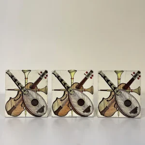 Gruppo di tre fermalibri metallo bianco decoro strumenti musicali - Piero Fornasetti