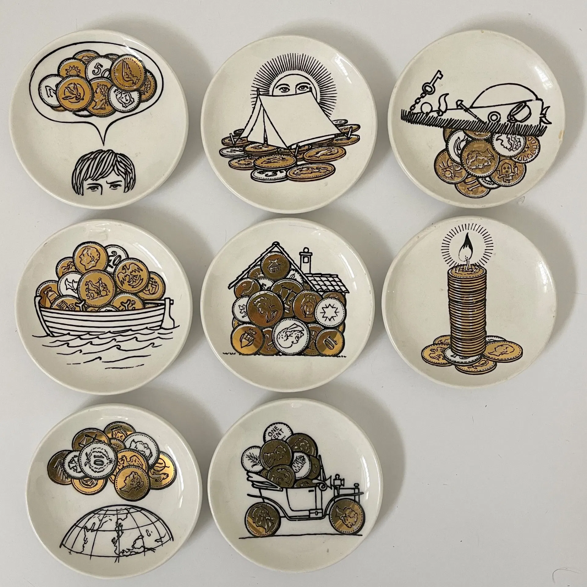 FORNASETTI PIERO, Otto sottobicchieri decoro "Monete" per Banca Unione Milano